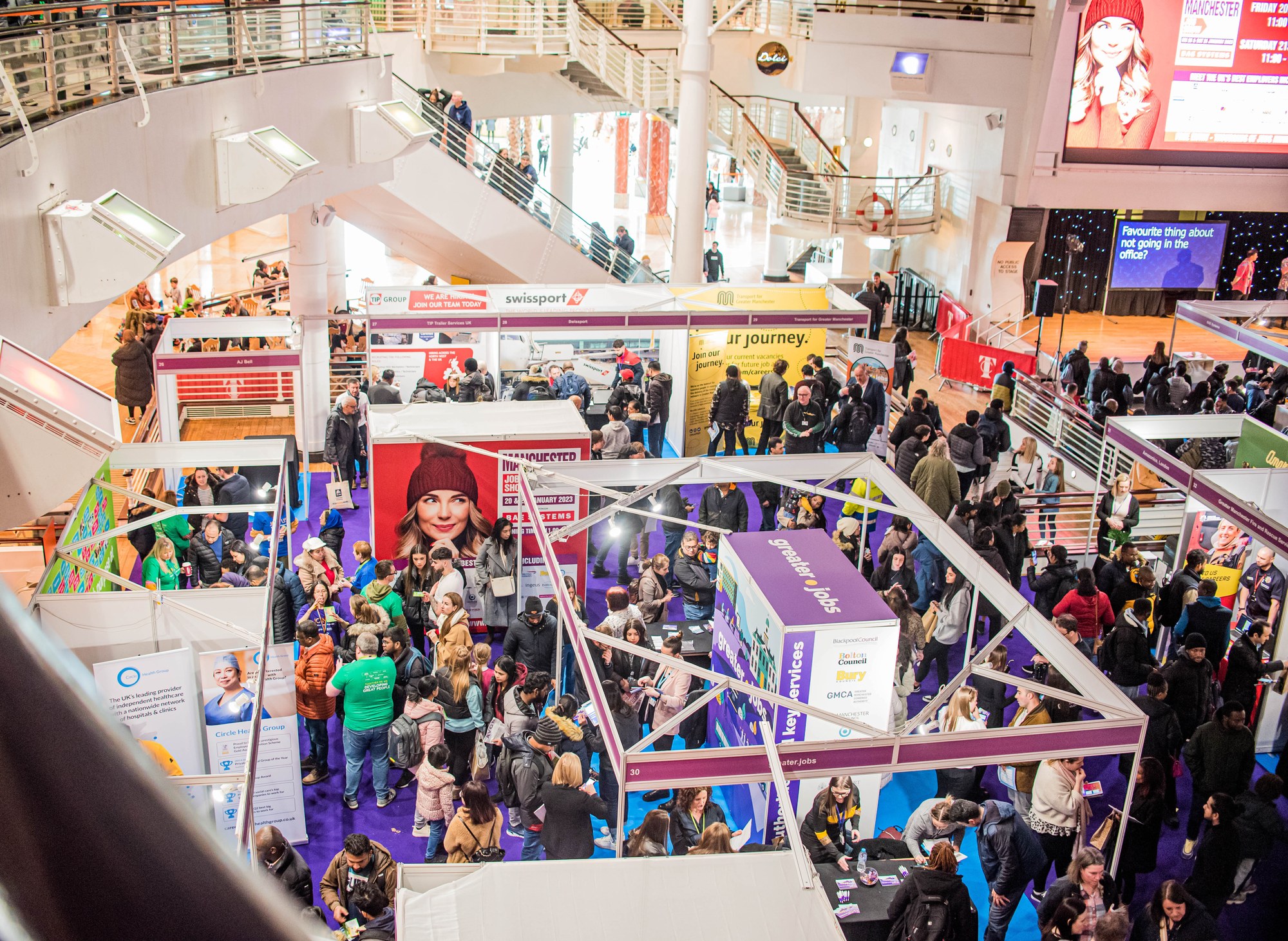 A busy Manchester Job Show floor with employers recruiting at The Trafford Centre